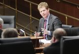 Representative Stephenson speaks to someone out of view at a Committee Hearing.