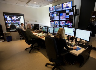 Staff working in House television production room