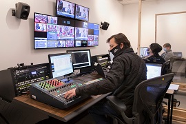 Staff working in Senate television production room