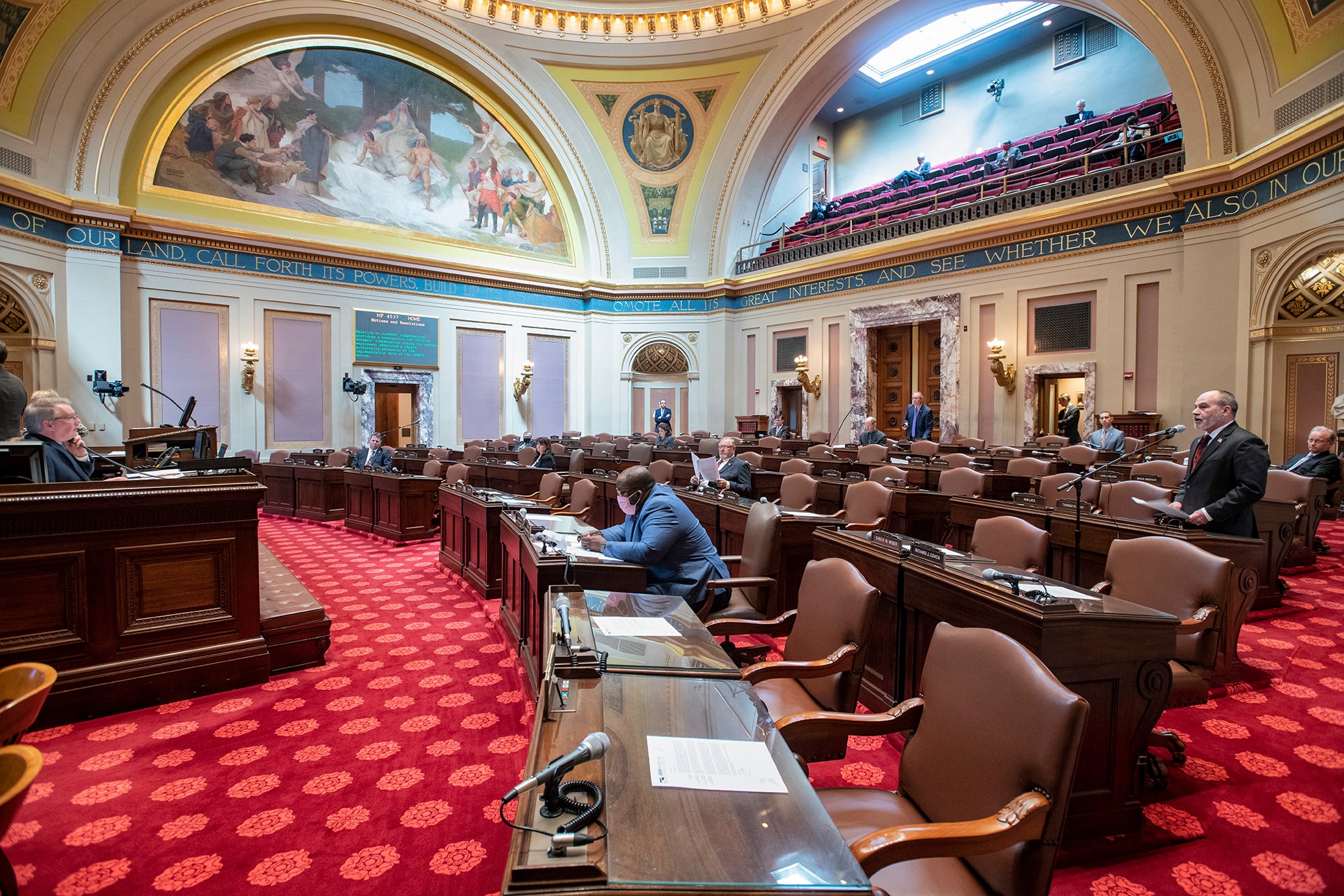 The Senate Chamber shows member spaced apart for session in 2020